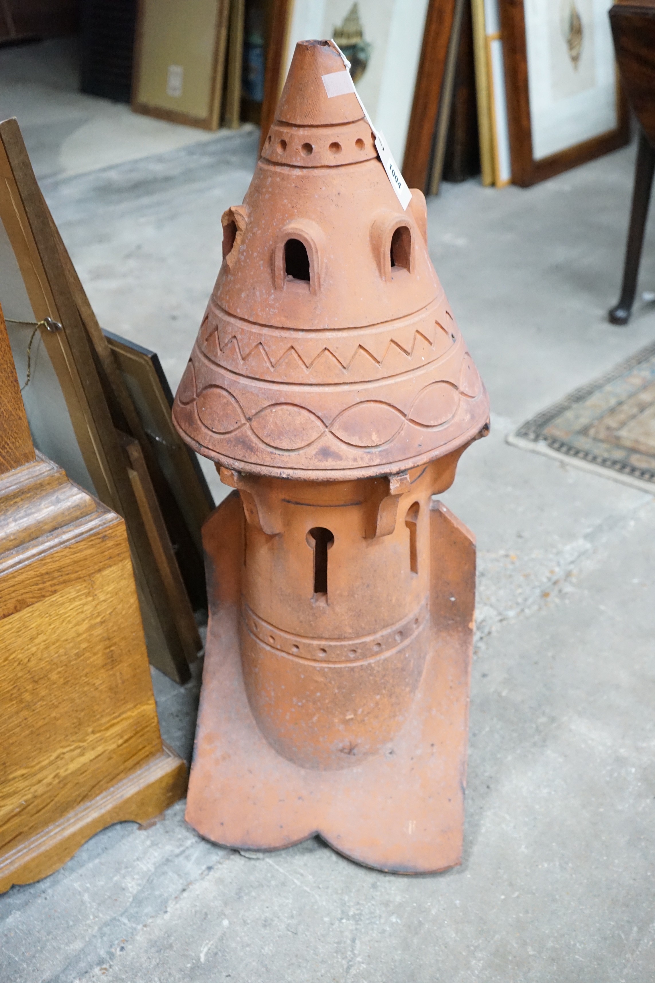 A terracotta dovecote hip tile, height 89cm